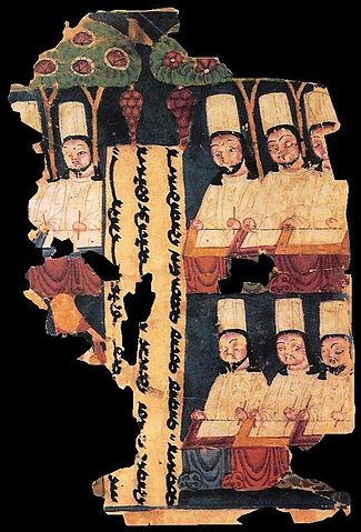 Manichean priests (Iranian Gnostic Sect) writing at their desks, with panel inscription in Sogdian. Manuscript from Khocho, Tarim Basin.